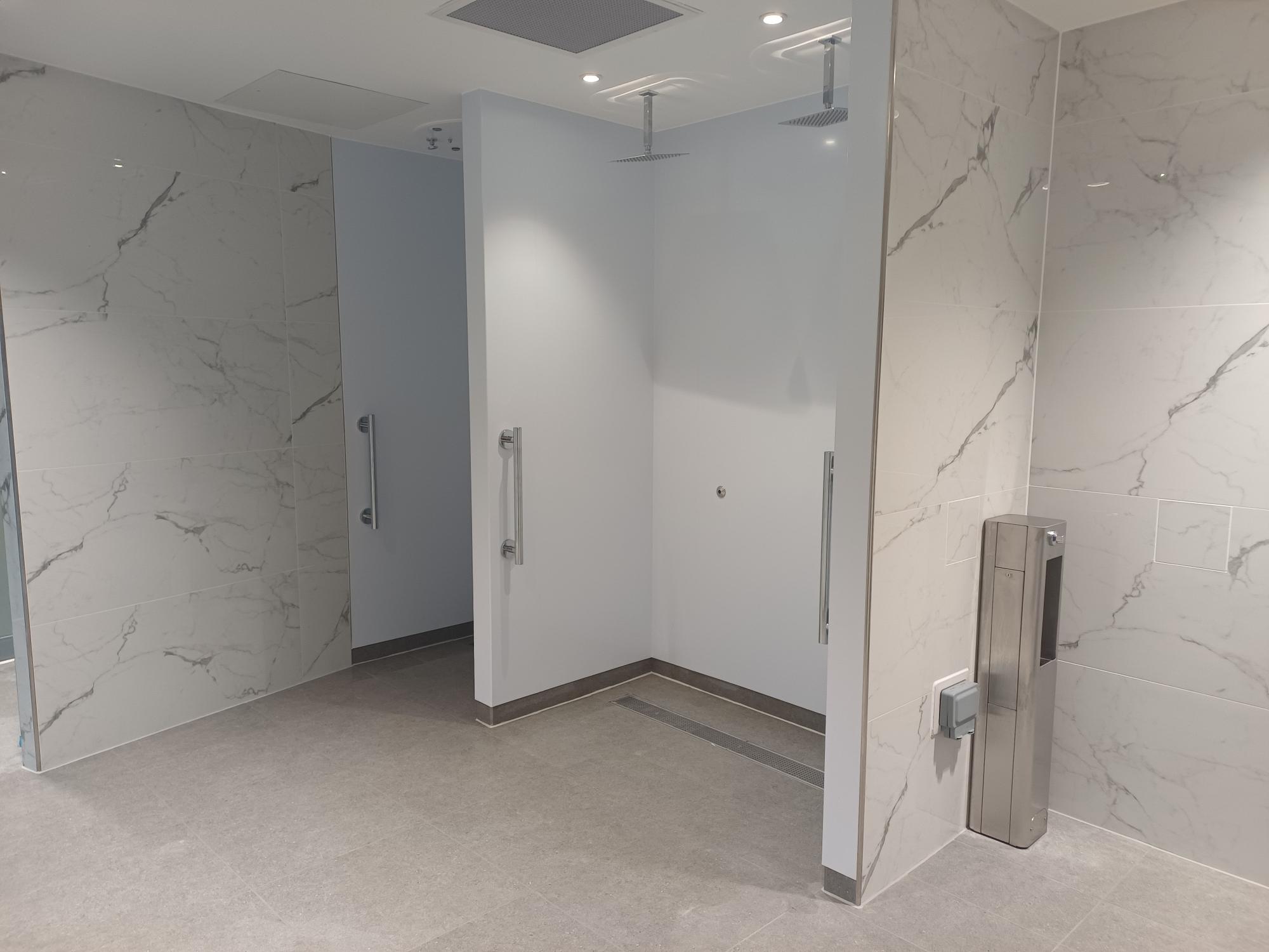 New waterfall showers featuring marble style wall/cubicles